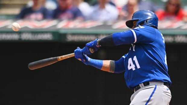 Jun 1, 2022; Cleveland, Ohio, USA; Kansas City Royals first baseman Carlos Santana (41) hits a single during the fourth inning against the Cleveland Guardians at Progressive Field. Mandatory Credit: Ken Blaze-USA TODAY Sports